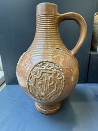 Two armorial stoneware jugs, Raeren, one dated 1586, 16/17th C.