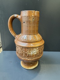 A Raeren stoneware 'peasant dance' jug, late 16th C.