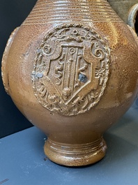 Two armorial stoneware jugs, Raeren, one dated 1586, 16/17th C.