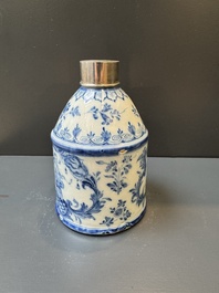 A Dutch Delft blue and white tea caddy with a pipe smoker, 18th C.