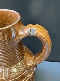 A Raeren stoneware 'peasant dance' jug, late 16th C.