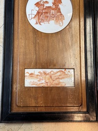 A Chinese four-part folding screen with iron-red-decorated porcelain plaques, 19/20th C.