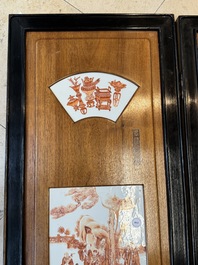 A Chinese four-part folding screen with iron-red-decorated porcelain plaques, 19/20th C.