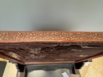 A rectangular Chinese carved red lacquer 'dragon' table screen, later wooden stand, Qianlong