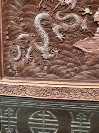 A rectangular Chinese carved red lacquer 'dragon' table screen, later wooden stand, Qianlong