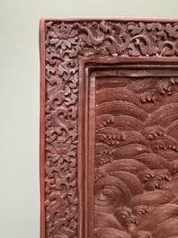 A rectangular Chinese carved red lacquer 'dragon' table screen, later wooden stand, Qianlong