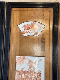 A Chinese four-part folding screen with iron-red-decorated porcelain plaques, 19/20th C.