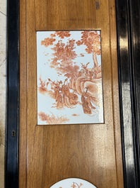 A Chinese four-part folding screen with iron-red-decorated porcelain plaques, 19/20th C.