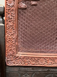A rectangular Chinese carved red lacquer 'dragon' table screen, later wooden stand, Qianlong