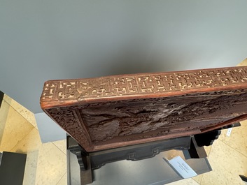 A rectangular Chinese carved red lacquer 'dragon' table screen, later wooden stand, Qianlong