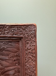 A rectangular Chinese carved red lacquer 'dragon' table screen, later wooden stand, Qianlong