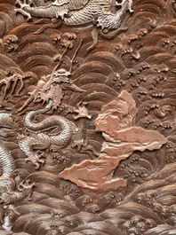 A rectangular Chinese carved red lacquer 'dragon' table screen, later wooden stand, Qianlong