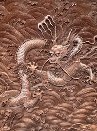 A rectangular Chinese carved red lacquer 'dragon' table screen, later wooden stand, Qianlong