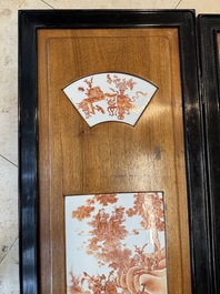 A Chinese four-part folding screen with iron-red-decorated porcelain plaques, 19/20th C.