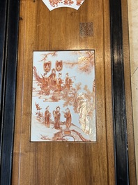 A Chinese four-part folding screen with iron-red-decorated porcelain plaques, 19/20th C.