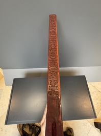A rectangular Chinese carved red lacquer 'dragon' table screen, later wooden stand, Qianlong