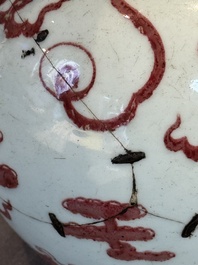 A Chinese copper-red and white 'dragon' bottle vase, 18th C.