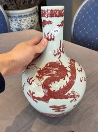 A Chinese copper-red and white 'dragon' bottle vase, 18th C.
