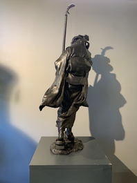A large Japanese bronze okimono of a musician, Shinpūsei 森風聲作 mark, Meiji, 19th C.