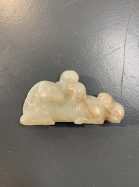 Five Chinese jade carvings with four wooden stands, 19th C.