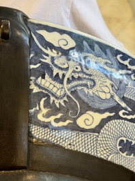 A massive Chinese blue and white reverse-decorated  'dragon' charger with bronze mounts, Chuxiu Gong Zhi mark, Guangxu