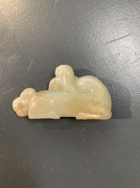 Five Chinese jade carvings with four wooden stands, 19th C.