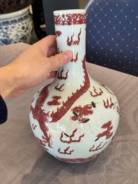 A Chinese copper-red and white 'dragon' bottle vase, 18th C.