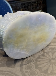 An exceptional and large Chinese carved pale lavender jadeite Guanyin on a wooden stand, Republic