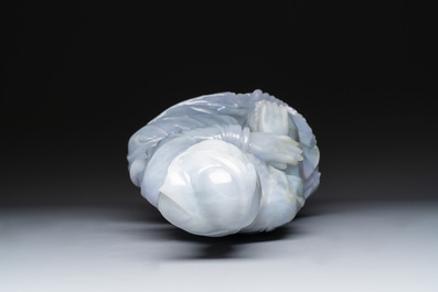 An exceptional and large Chinese carved pale lavender jadeite Guanyin on a wooden stand, Republic