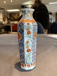 Two polychrome Dutch Delft petit feu vases with floral design, early 18th C.