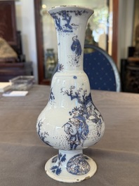A Dutch Delft blue, white and manganese pear-shaped chinoiserie vase, late 17th C.