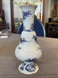A Dutch Delft blue, white and manganese pear-shaped chinoiserie vase, late 17th C.