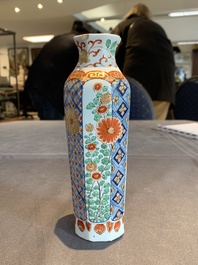Two polychrome Dutch Delft petit feu vases with floral design, early 18th C.