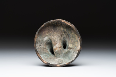 A Japanese bronze sculpture of a boy feeding a bird on a wooden stand, signed, Meiji, 19th C.