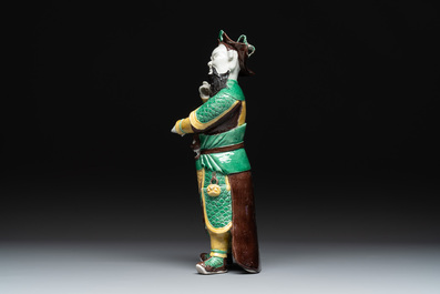 A pair of Chinese sancai-glazed rooftiles, a pair of Buddhist lions and a warrior, Ming and later
