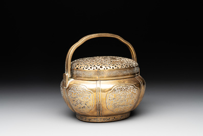 A Chinese bronze 'landscape' handwarmer, Qiu Fuxi 丘福禧 mark, 19th C.