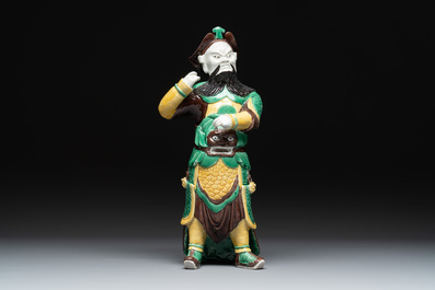 A pair of Chinese sancai-glazed rooftiles, a pair of Buddhist lions and a warrior, Ming and later