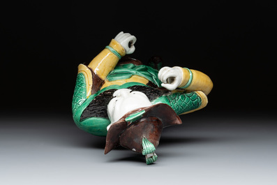 A pair of Chinese sancai-glazed rooftiles, a pair of Buddhist lions and a warrior, Ming and later