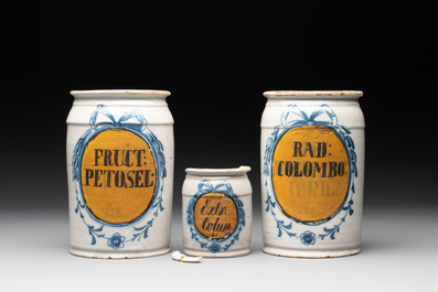 Three rare blue and white Delftware albarelli with painted content medallions and paper shop labels, Northern Europe, 18th C.