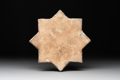 A Kashan lustre-glazed star tile, Persia, 13/14th C.