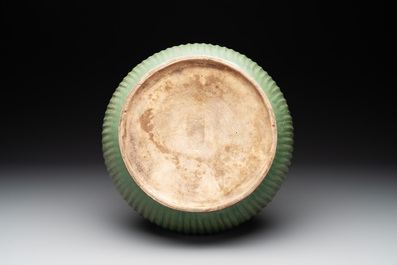 A Chinese Longquan celadon 'lotus' bowl and a large green-glazed jar, Ming and later