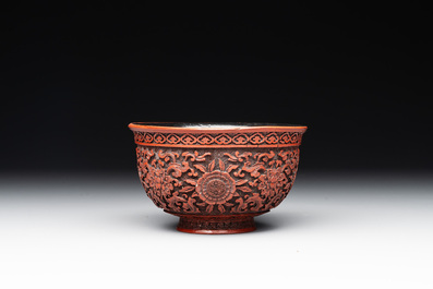A Chinese cinnabar lacquer quadrifoil covered box and a 'lotus and shou' bowl, 19th C.