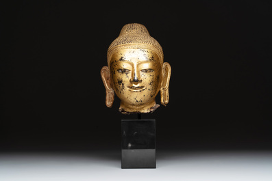 A Burmese gilt-lacquered bronze head of Buddha, 19th C.