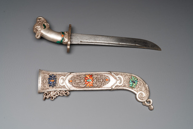 A large Tibetan coral- and precious stone-inlaid silver dagger, 19th C.