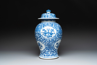 A Chinese blue and white 'antiquities and peony scrolls' vase and cover, Kangxi