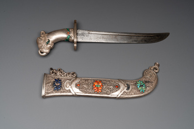 A large Tibetan coral- and precious stone-inlaid silver dagger, 19th C.