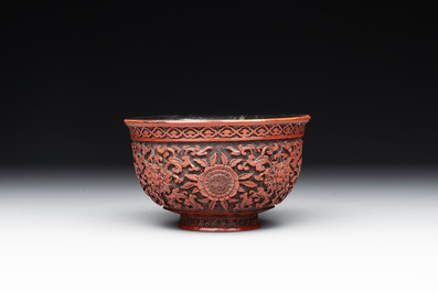 A Chinese cinnabar lacquer quadrifoil covered box and a 'lotus and shou' bowl, 19th C.