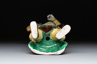 A pair of Chinese sancai-glazed rooftiles, a pair of Buddhist lions and a warrior, Ming and later