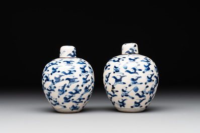A pair of Chinese blue and white soft paste '100 boys' covered jarlets and a seal paste box, Kangxi mark, 19th C.