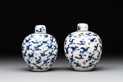 A pair of Chinese blue and white soft paste '100 boys' covered jarlets and a seal paste box, Kangxi mark, 19th C.